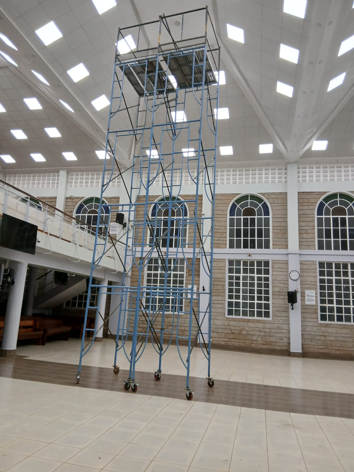 Four-set mobile scaffold tower with castor wheels and a guard rail